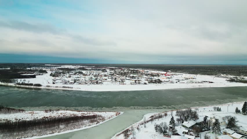 Aerial drone orbit of Opaskwayak Cree Nation with Saskatchewan River view