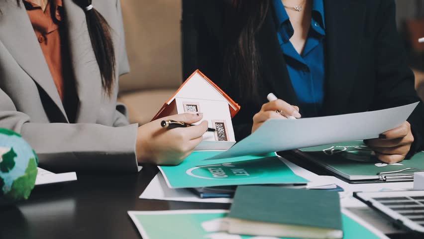 Group of business ESG meeting environment, society and governance, discussing renewable energy wind turbine solar panel
