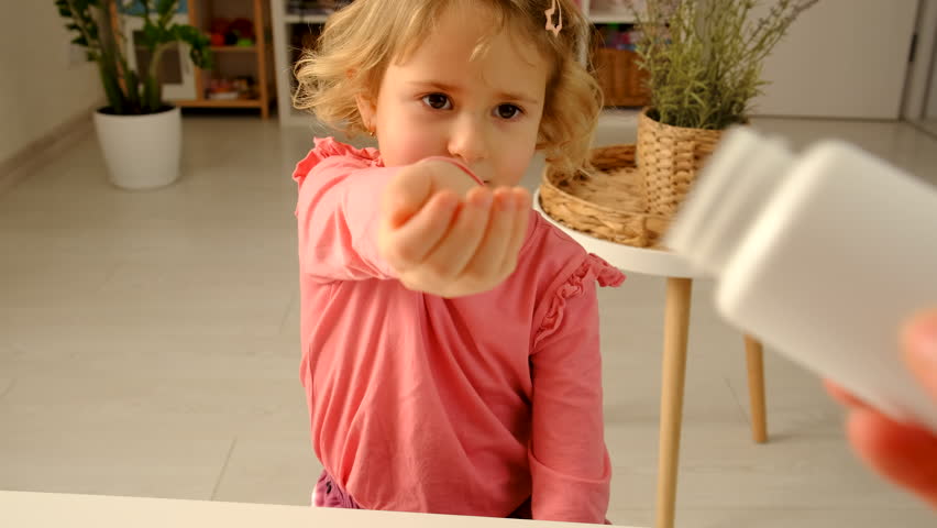 child with jelly beans. Selective focus.
