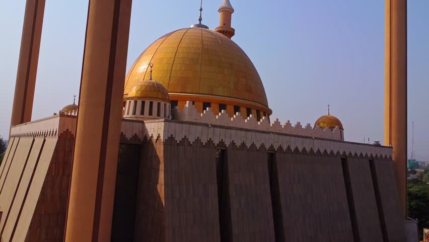 Jib up of the golden dome on top of a beautiful mosque in Abuja, Nigeria