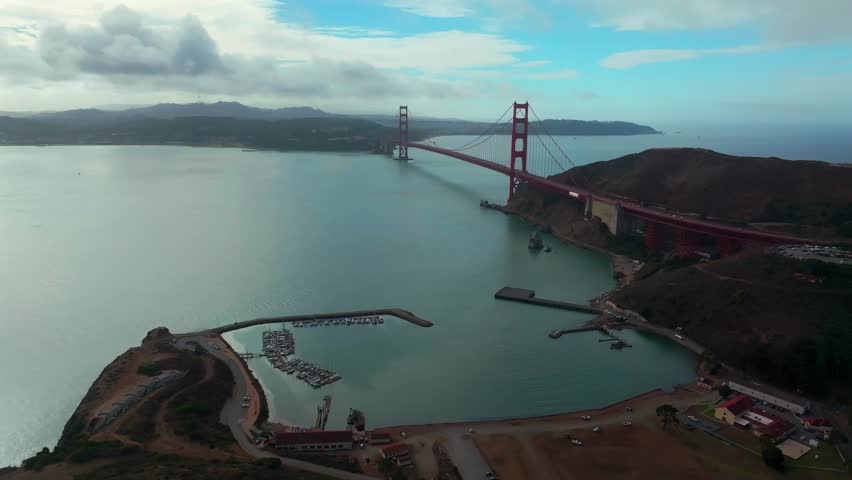 San Francisco Golden Gate Bridge aerial drone California Point Cavallo Needles Rock Horseshoe Bay Area Dana Bowers Vista Point cloudy mist misty fog blue skies Sausalito cars traffic forward pan up