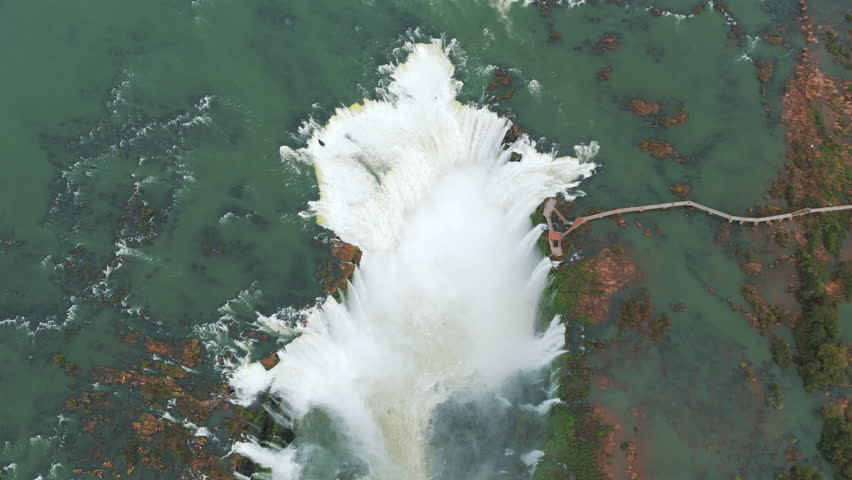 Top aerial view of Iguazu Falls. World Heritage Site. Planet Conservation. Brazil - Argentina. 4k