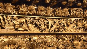The temple's support beams are filled with finely detailed, gold-plated carvings. - Powered by Shutterstock - Get 15% off with code: PIKWIZARD15