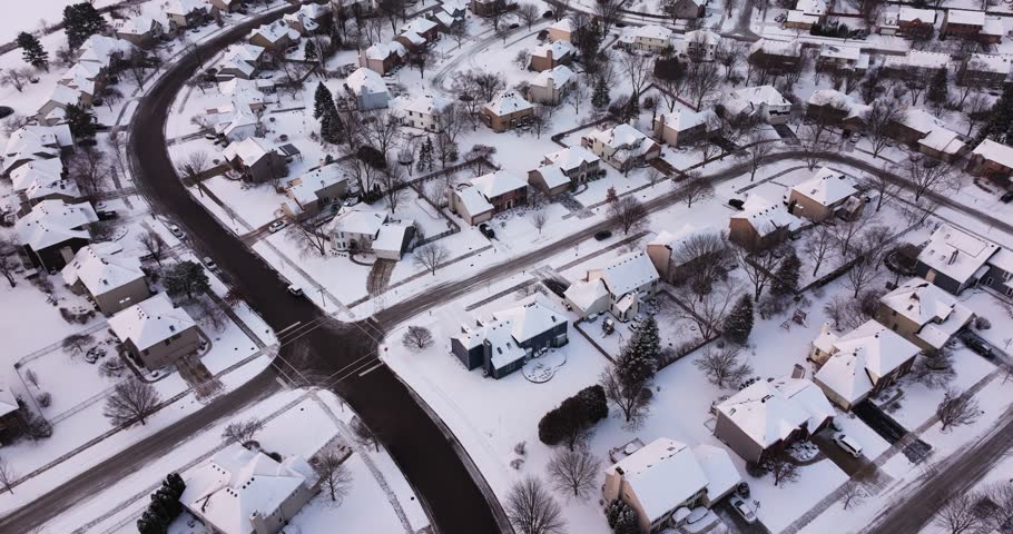 Spectacular Drone Shot Above Suburban Neighborhood in America. Winter Snow Day