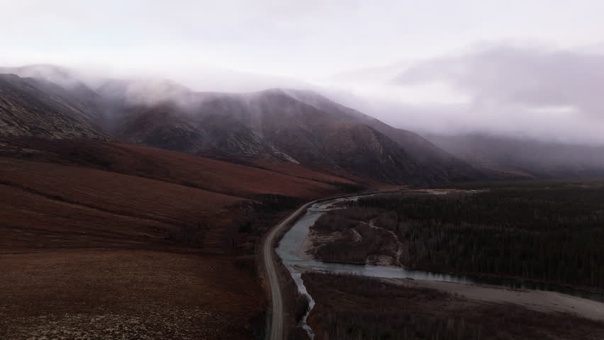 Dempster Highway Through Ogilvie Mountains In Yukon, Canada - Aerial Shot