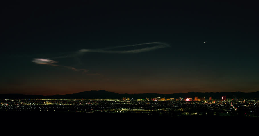 Las Vegas electric skyline complemented by the mysterious “twilight phenomenon” that hovers in the sky at dusk. 