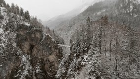 Marienbrucke bridge with tourists in winter snowfall, Drone shot - Powered by Shutterstock - Get 15% off with code: PIKWIZARD15