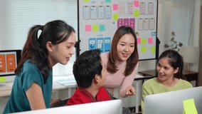 Diverse programming team collaborating on mobile app interface design, analyzing project details while working together at desktop computer in contemporary office environment - Powered by Shutterstock - Get 15% off with code: PIKWIZARD15