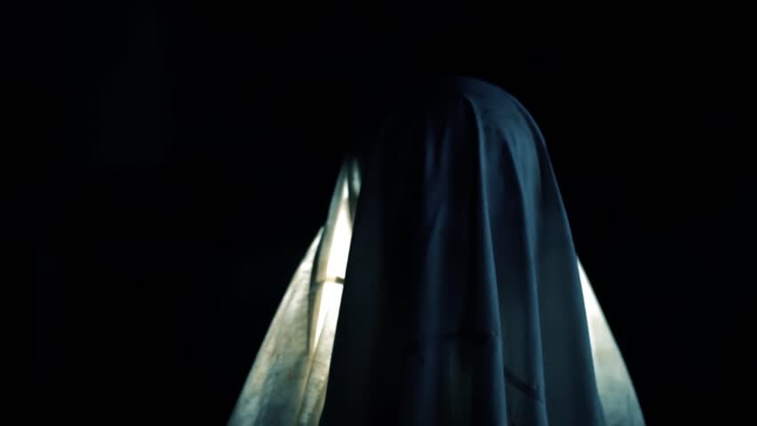 Cinematic Shot of a Man as a Ghost with Cloth Dramatic Lighting Halloween Concept Emotional Expression Fear and Surprise