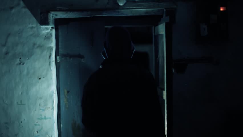 Scary Shot of an Old Wooden Door with Light Leaks Through Cracks in a Dark Horror Film-Like Scene Mysterious and Ominous Atmosphere Full HD