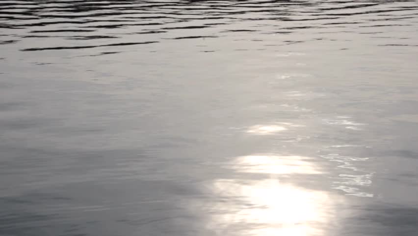 nature background of water surface with sunlight reflections (FULL HD)
