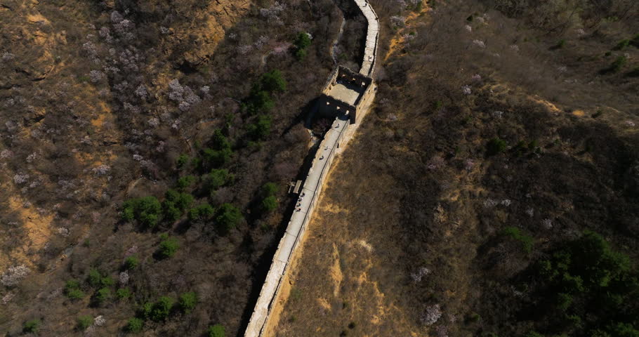 Above View Of Tourists Trekking On The Paved Walkway Of Jinshanling Great Wall In Beijing China. Aerial Shot