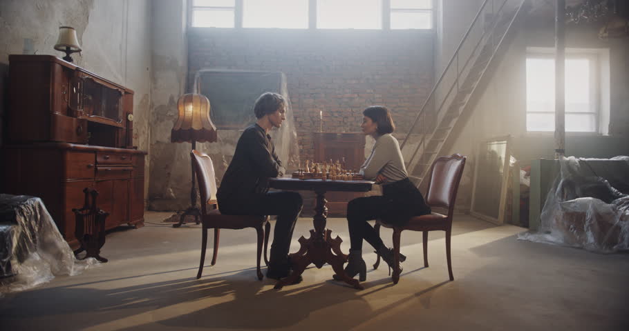 Intense Chess Game Between a Woman and Man in a Vintage Setting: Psychological Tension, Strategic Thinking, and Bold Moves