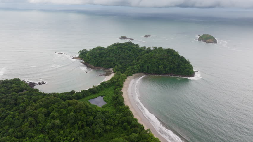 Experience the stunning and breathtaking aerial view of Playa Manuel Antonio, located within the beautiful and exotic national park of Costa Rica