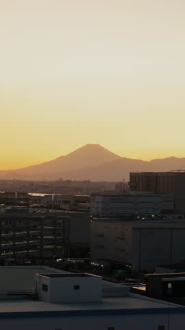 Mt. Fuji and Yokohama Skyline over the Industrial Area in Kawasaki City at Sunset (Vertical Timelapse)