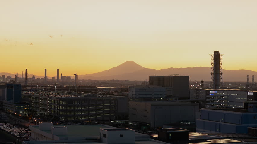 Mt. Fuji and Yokohama Skyline over the Industrial Area in Kawasaki City at Sunset (Timelapse | ZOOM IN)