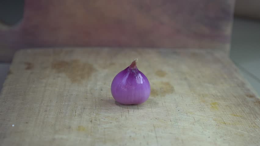 A charming still life of red onions nestled on a rustic wooden surface. It beautifully highlights fresh produce and celebrates the essence of natural ingredients!