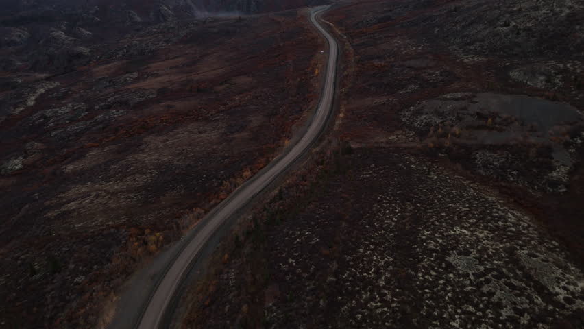 Dempster Highway And Ogilvie Mountain Range In Yukon, Northwest Territories, Canada. Aerial Drone Shot