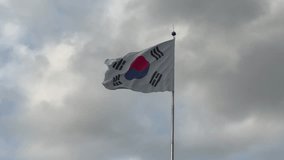 Taegukgi, South Korea national flag is waving on a cloudy day. - Powered by Shutterstock - Get 15% off with code: PIKWIZARD15