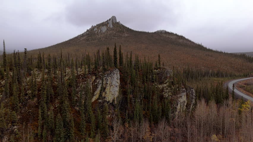 Scenic Ogilvie Mountains On A Cloudy Day In Yukon Territory, Canada - Drone Shot