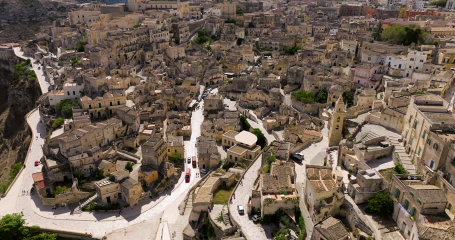 Dense City With Ancient Dwellings Over Matera In The Region of Basilicata, Southern Italy. Aerial Drone Shot