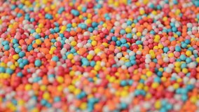 Round colorful confectionery sprinkles rotating. Side view. Baking decoration. - Powered by Shutterstock - Get 15% off with code: PIKWIZARD15