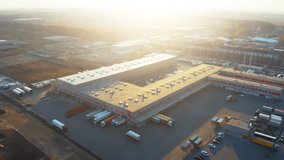 Aerial All-Round View of Modern Logistics Warehouse with Loading Docks and Semi-tTrailer Trucks - Freight Distribution Center from Drone Shot - Powered by Shutterstock - Get 15% off with code: PIKWIZARD15