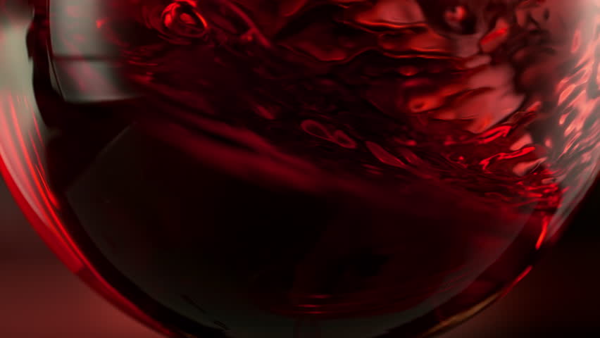 Super Slow Motion Detail Shot of Spinning Red Wine in Glass at 1000fps.