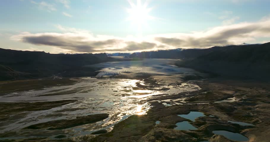Sunset over Greenland rocky shallow lagoon, Aerial view