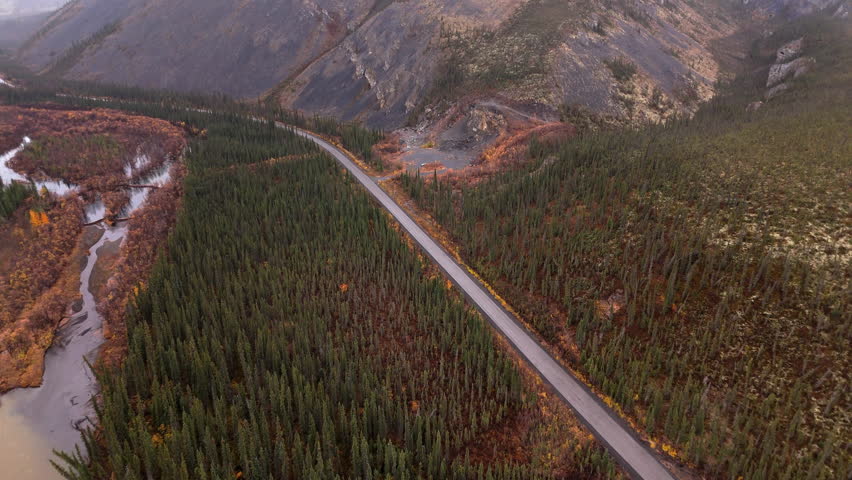 Dempster Highway Through The Slopes Of Ogilvie Mountains In Yukon, Canada. Aerial Drone Shot
