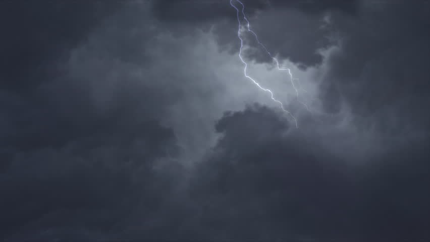 Thunderbolts in a cloudy sky. Multiple flashes of lightning against a dusky sky. Video looped.