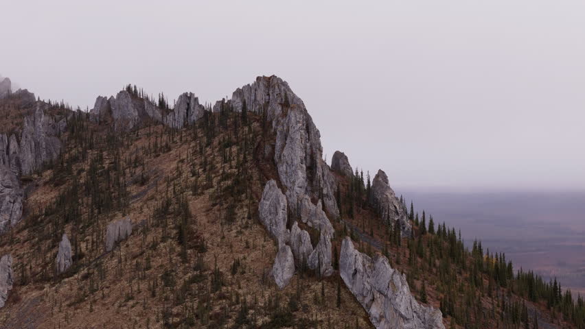 Rock Formations On Sapper Hill In Ogilvie Mountains, Yukon, Canada. drone shot