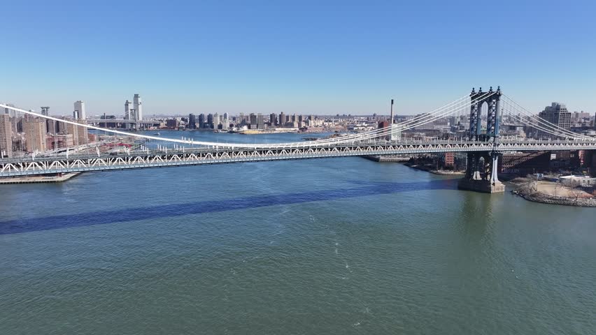 Brooklyn Bridge At Manhattan In New York United States. Highrise Buildings Scenery. Traffic Landscape. Brooklyn Bridge At New York United States. Coastline Background.