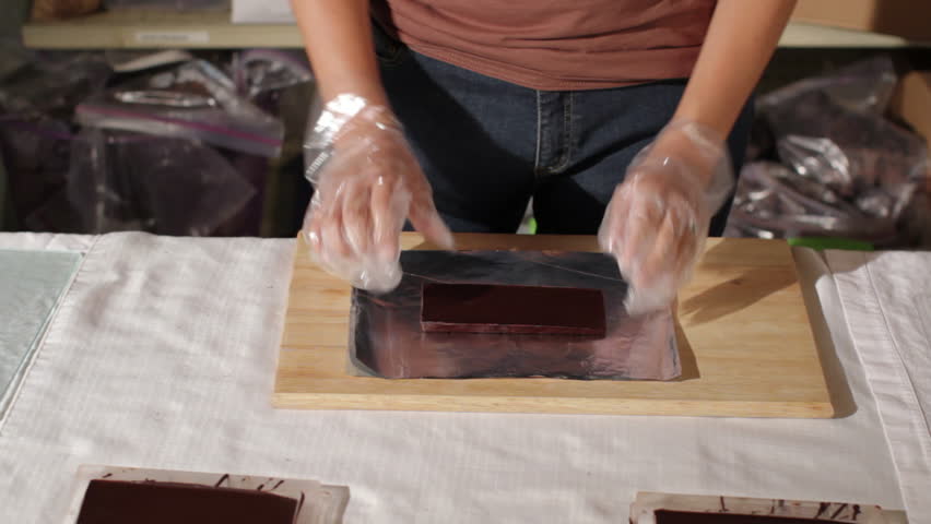 Hand made chocolate is wrapped in foil.