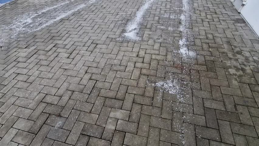 road salt, what is it that is sprinkled on roads, should I sprinkle it on paving around my house, will it not corrode paintsurface, sprinkled salt and in spring it all started, break off and chip,