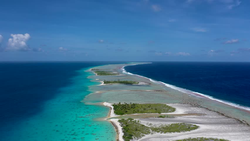 One of the biggest atoll in the world. Fakarava islands from above. Paradise in the middle of Pacific ocean. Atoll near Tahiti in French Polynesia