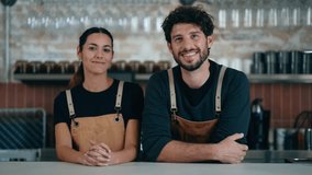 Video of two younger waiters looking at camera in a pastry shop. - Powered by Shutterstock - Get 15% off with code: PIKWIZARD15