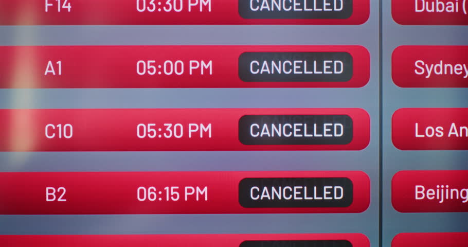 International Airport Terminal: Digital Arrival and Departure Information Display Showing Useful Flight Data For Travelers. Canceled Flights Due to Bad Weather Conditions or Terrorist Attack. Close Up