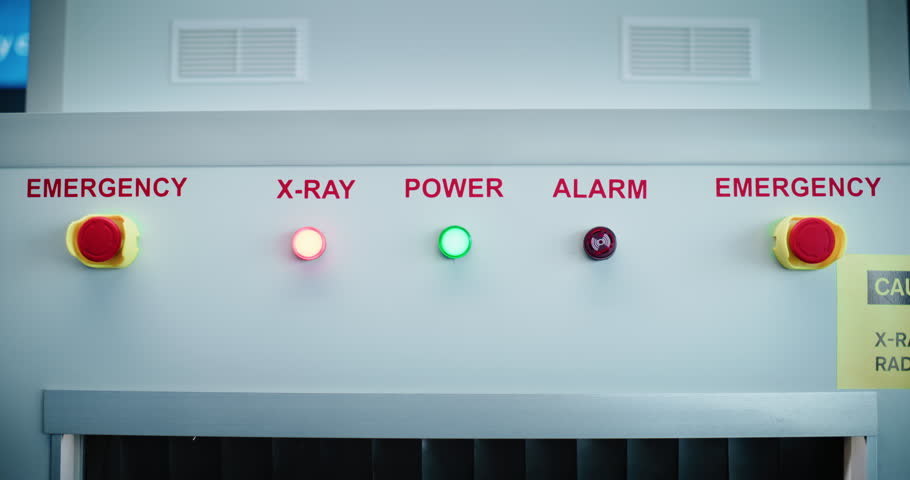 Security Checkpoint in Airport Terminal: Advanced Metal Detector X-ray Scanner with Illuminated Indicators on Control Panel for Luggage Scanning Procedure before Boarding Airplane Flight. Close Up.