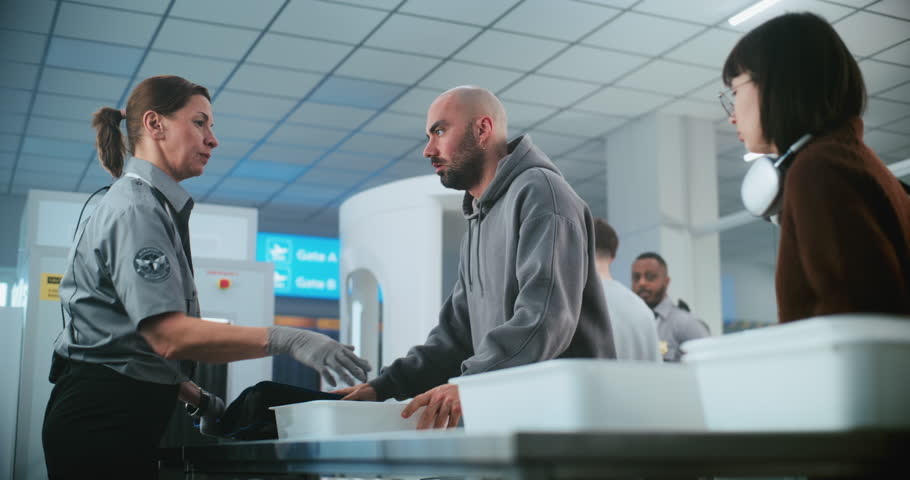 Diverse People, Travelers Putting Personal Items in Plastic Trays for X-ray Scanning on Conveyor Belt. Female TSA Worker Controlling Screening Procedure. Security Check in Airport for Boarding Flight.