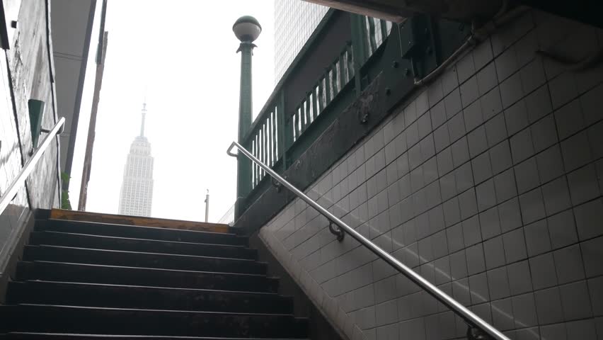 New York City underground subway globe, metro orb lamp. Empire State building. Metropolitan entrance stairway, Manhattan, 34 st. Midtown financial business district. Public transport station stairs.
