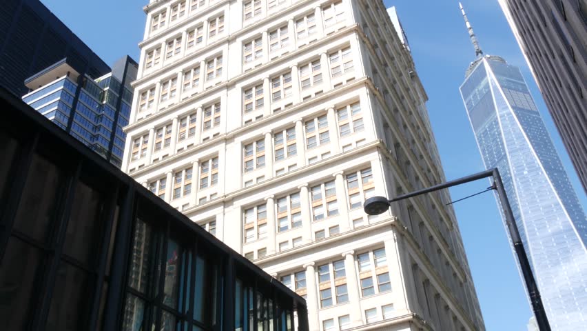New York City Lower Manhattan, Downtown Financial District architecture, United States. One World Trade Center skyscraper building, Fulton street, USA. American urban scene. WTC Freedom tower in NYC.