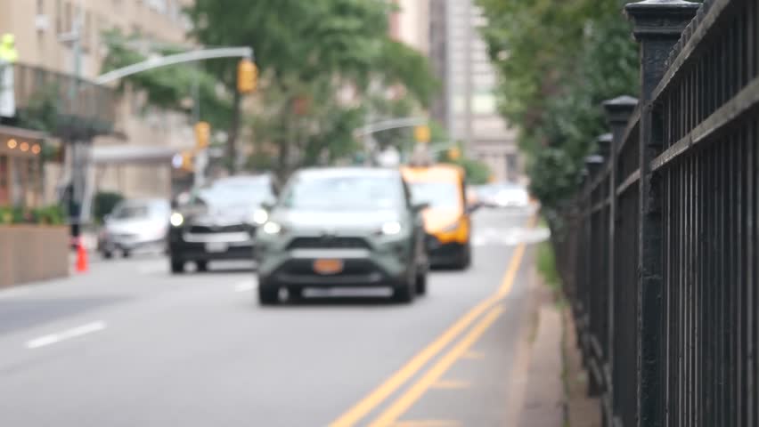 New York City Park Avenue. Grand Central Terminal railway station on 42 street. Manhattan Midtown. Yellow taxi cab in NYC, USA. American urban road car traffic, transport in United States. Defocused.