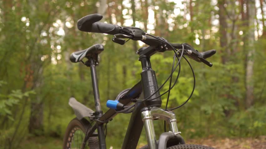 Bicycle, Smooth Camera Movement. Bicycle Standing in the Forest. Concept of Cycling and Cycling. Free Moving on Free Transport.