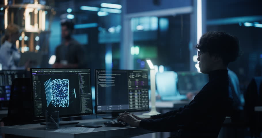 Asian Researcher Making a Quantum Computing Experiment, Monitoring Live Artificial Intelligence Data on Computer Screen, Running Software Code in Terminal Window. Developer Solving a Problem