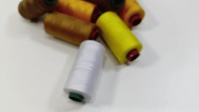 A detailed close-up of multicolored threads ranging from brown to gold, showcasing fine texture and shimmering fibers. The vibrant colors highlight the beauty of textile craftsmanship. - Powered by Shutterstock - Get 15% off with code: PIKWIZARD15