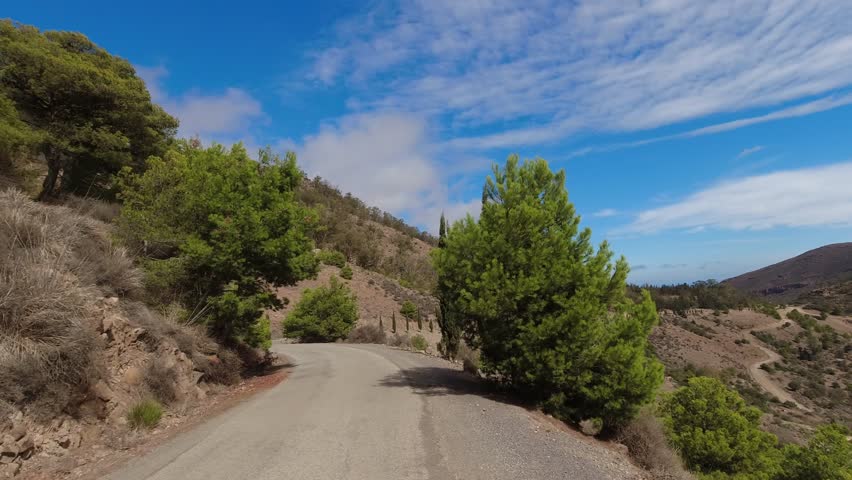 POV action cam riding or driving on narrowed gravel road in Morocco North Africa Nador mountains