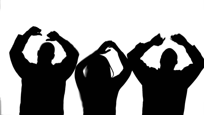 Silhoutted group of two men and a woman dancing, clapping and cheering. Black