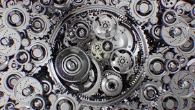 A detailed view of rotating gears, each driving another to form a seamless motion. A strong visual metaphor for a well-functioning machine or business structure. - Powered by Shutterstock - Get 15% off with code: PIKWIZARD15