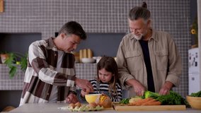 Multigenerational family gathering at kitchen counter, cooking together while grandfather teaches daughter culinary skills and father supports learning process - Powered by Shutterstock - Get 15% off with code: PIKWIZARD15